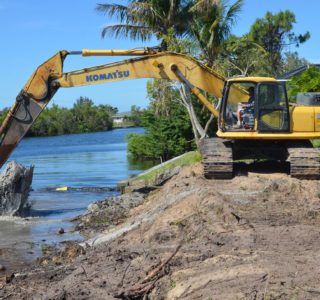 Bubba Williamson digging the water’s edge back to allow the new seawall to be positioned.